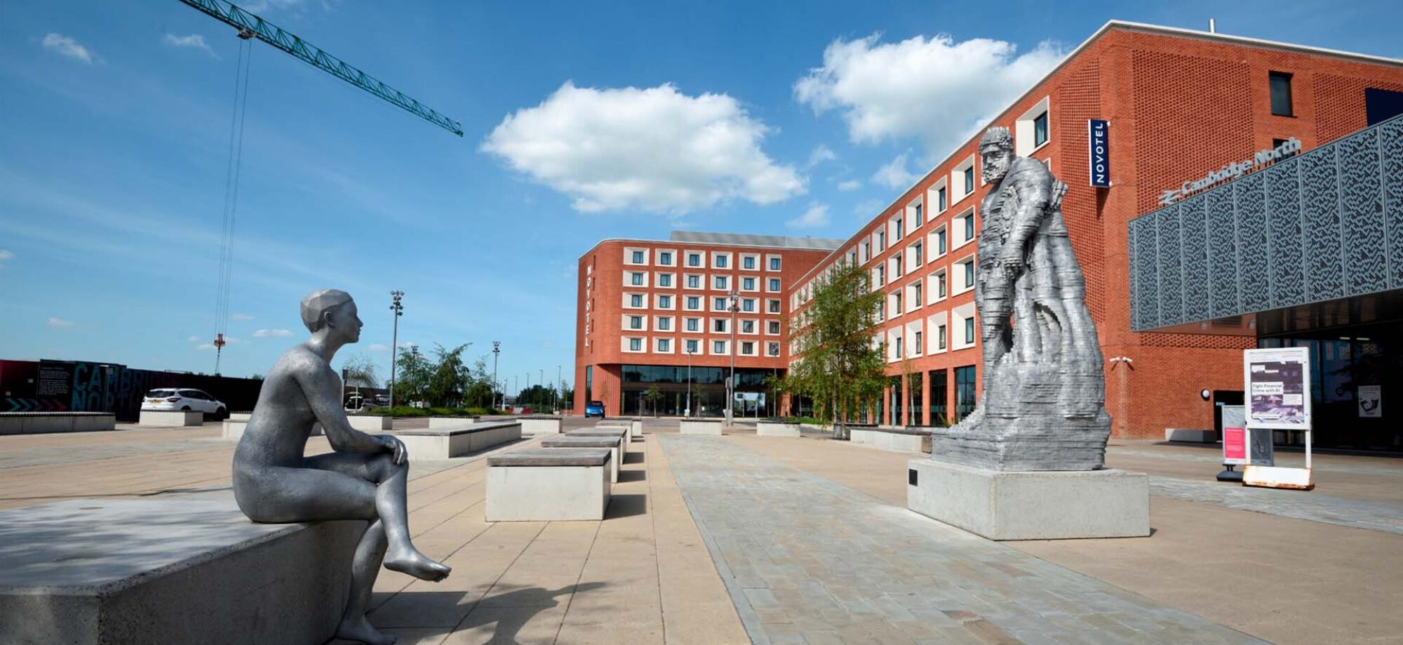 Cambridge Square and Novotel Hotel with 'Hercules Meets Galatea' sculptures in the foreground